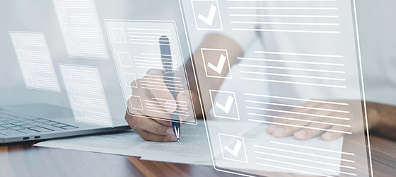 Person reviewing digital files and checklists